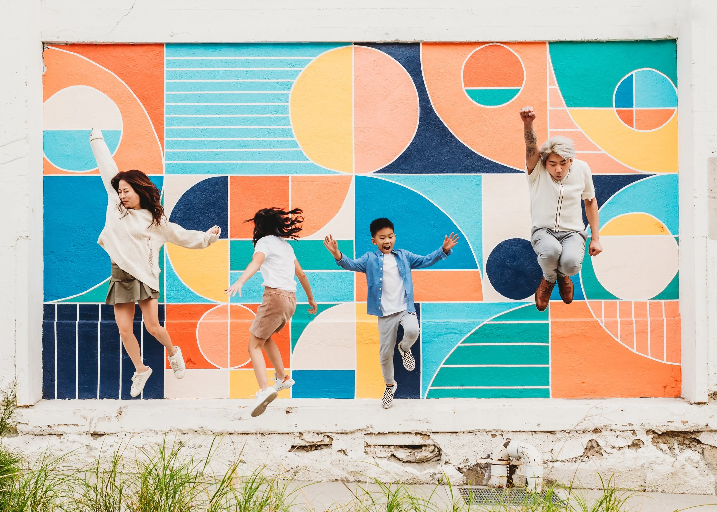 family jumping for family photo fun session