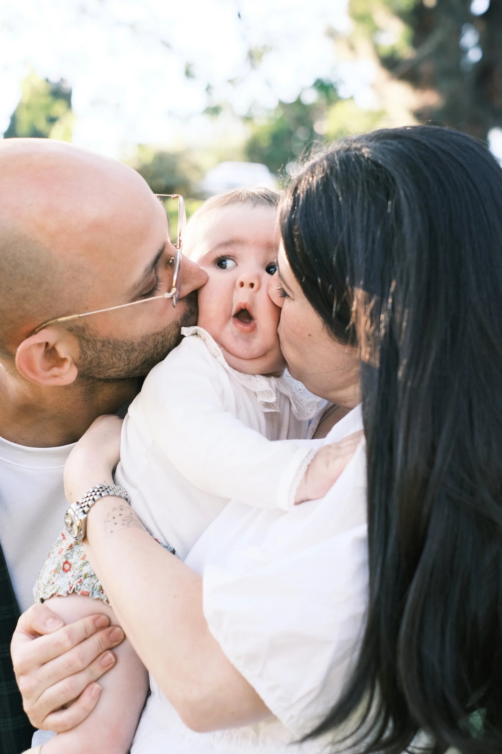 cute baby with parents.jpg