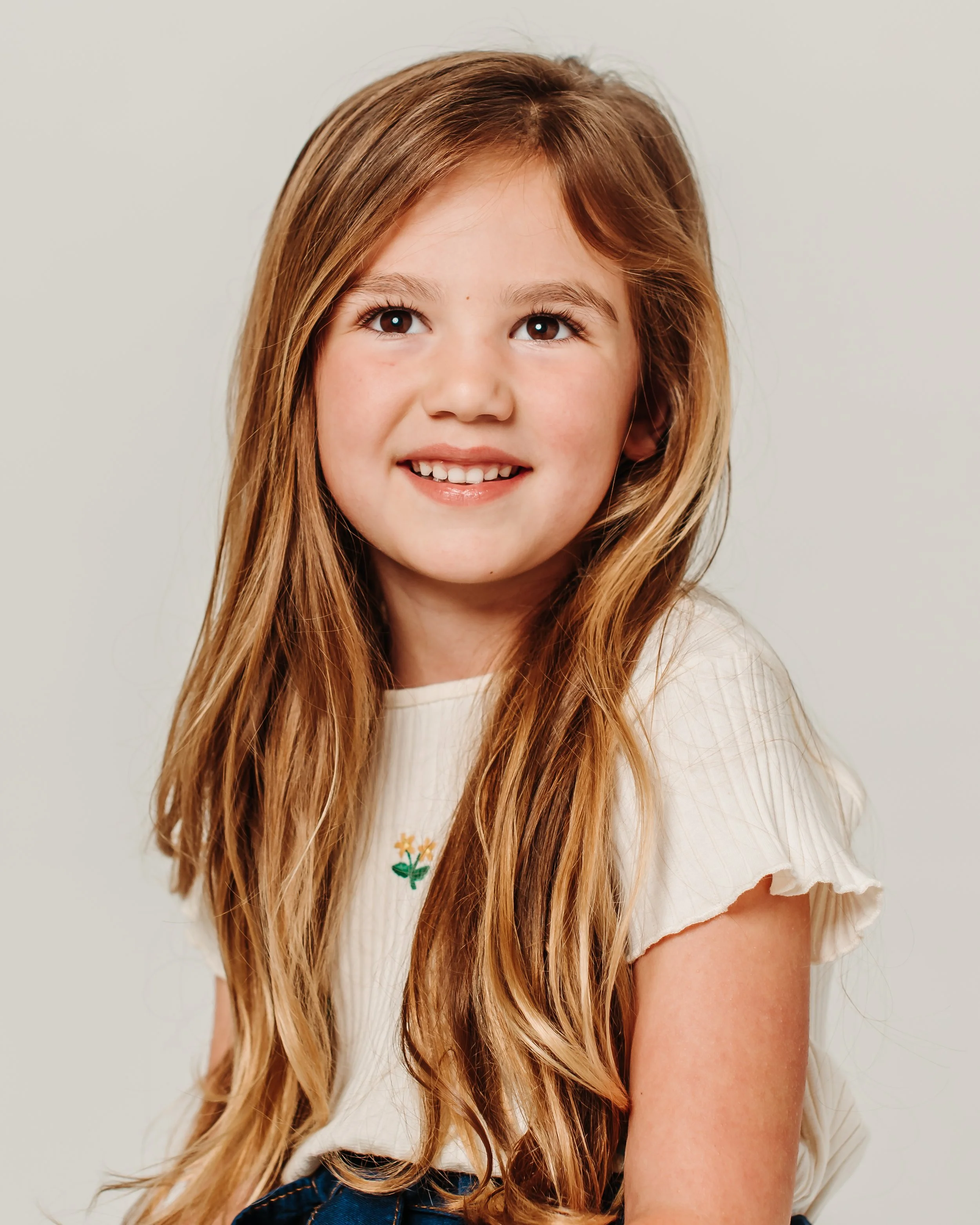 photo of a portrait of a girl smiling