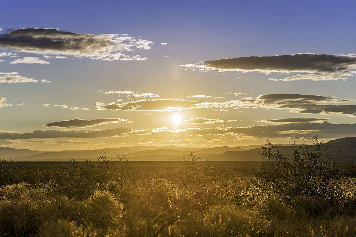 I was headed north on the 14 when the sun began to light up the night sky and ultimately emerge from behind the El Paso Mountains. Peaking through the clouds, the golden sunset on the Mojave started my trip on a high note.