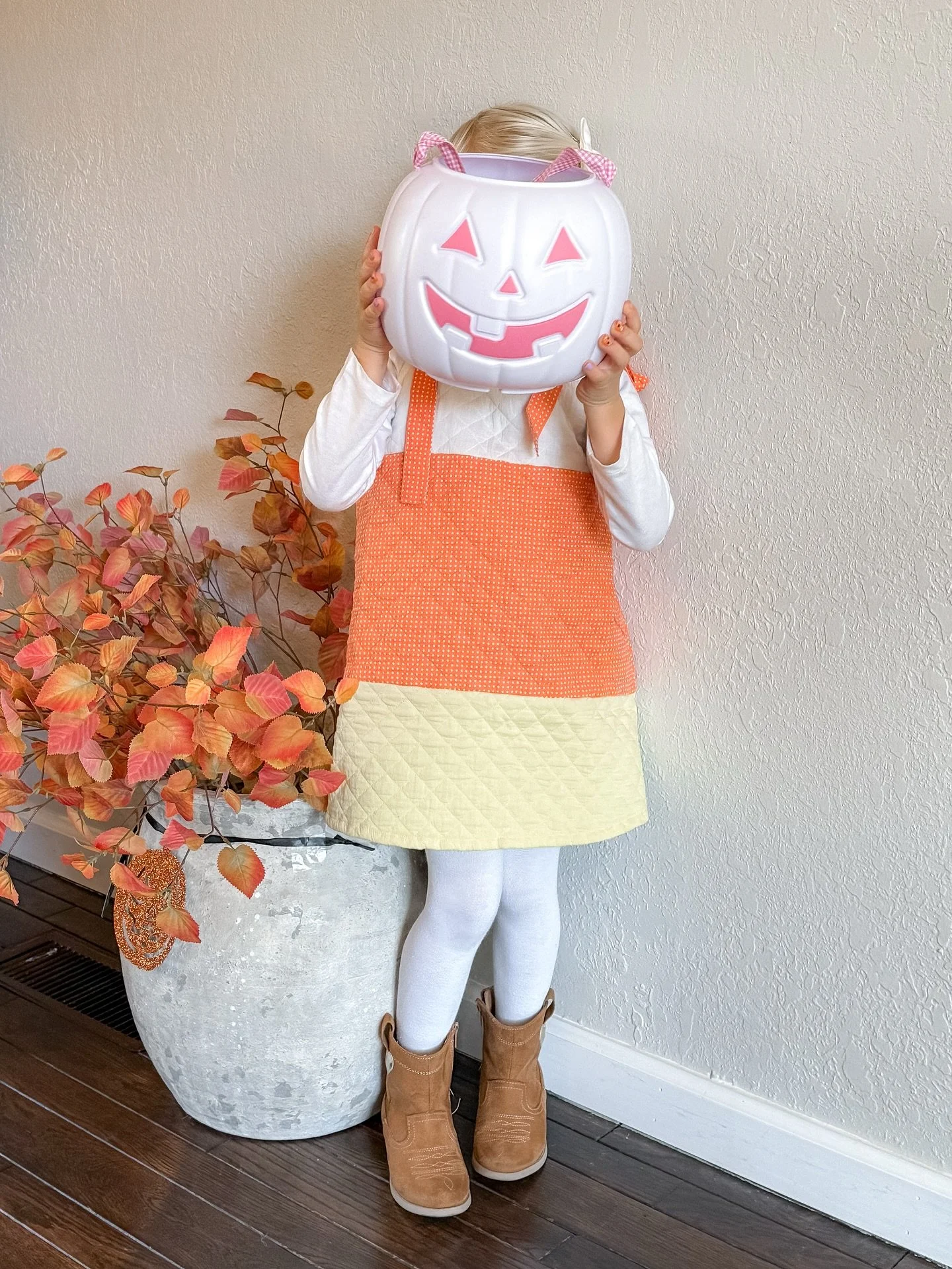 Our little candy corn cutie! 🤍🧡💛