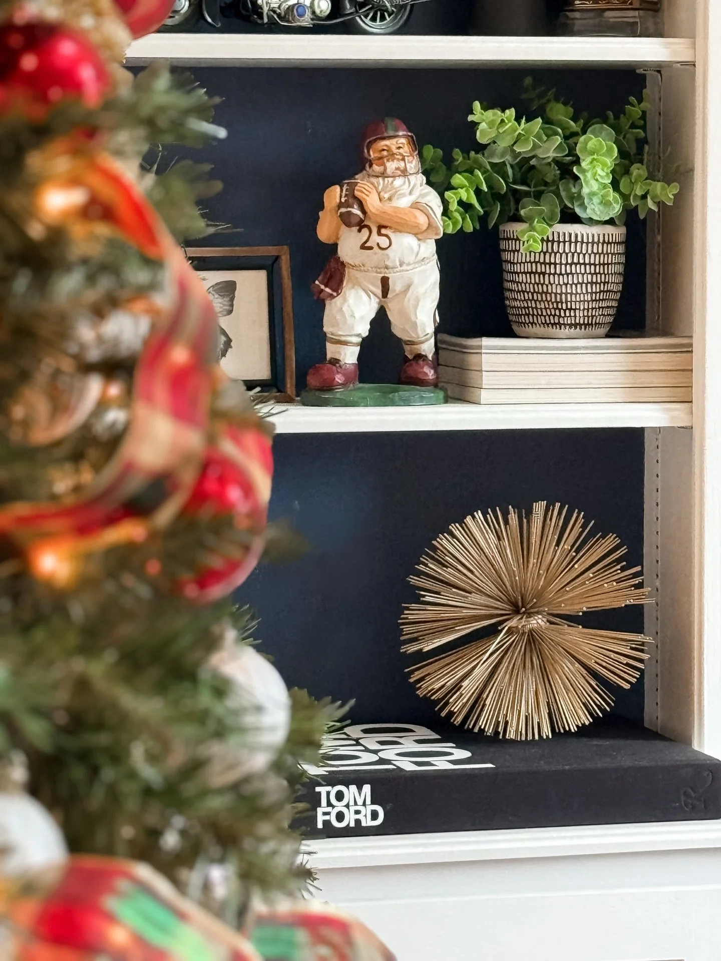 I love this football playing Santa in Brian&rsquo;s office. Such a fun piece!