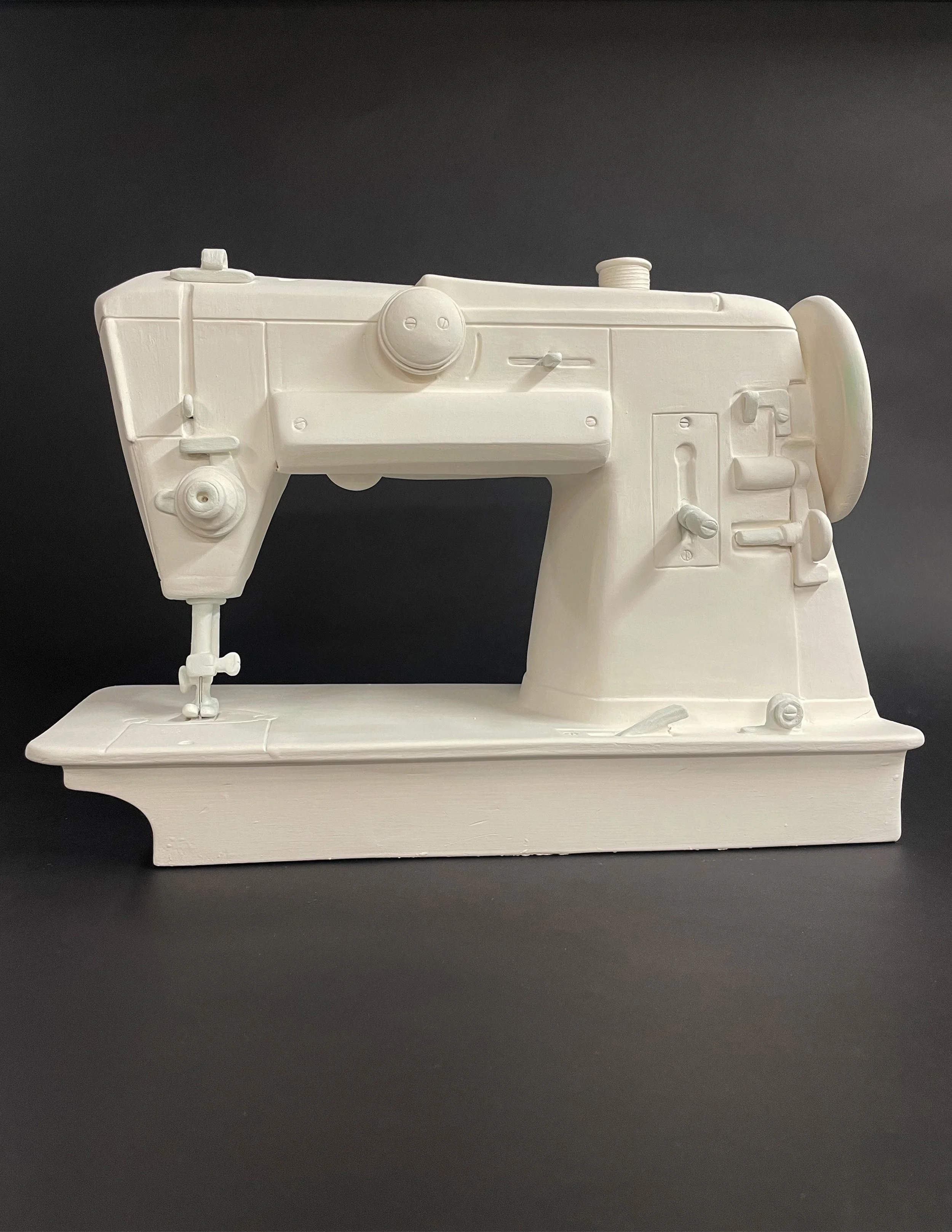 Hand built clay replica of my sewing machine my companion in the making of many dresses and things.