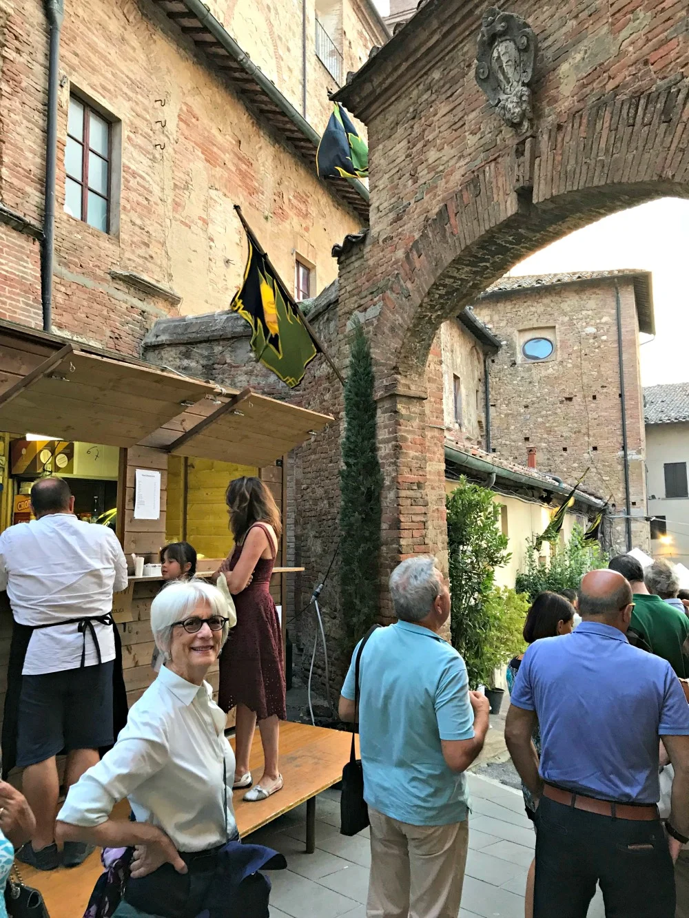 Waiting in line for yet another contrada dinner next to St. Augusto church.