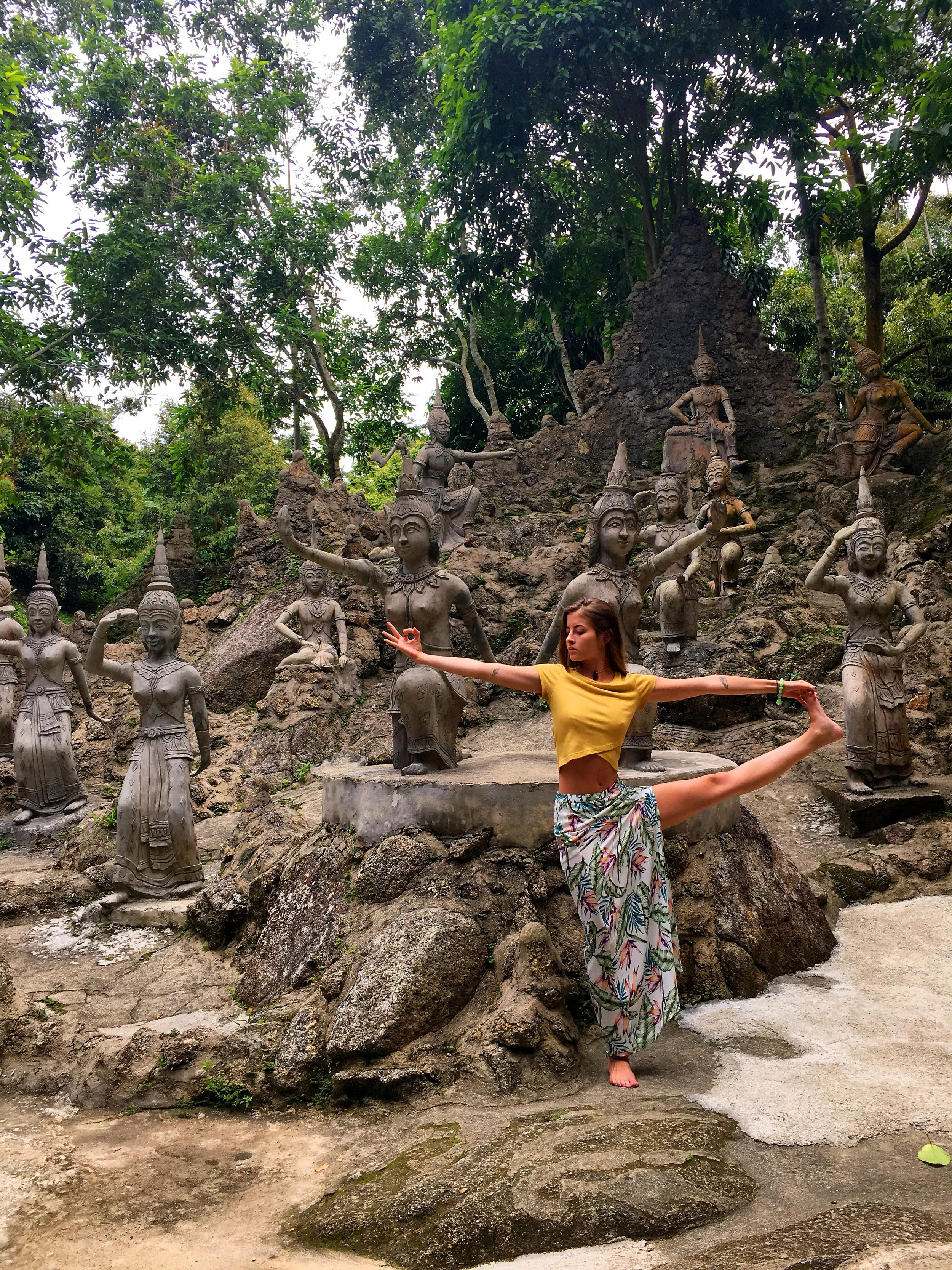 Utthita hasta padangusthasana among the Buddhas.