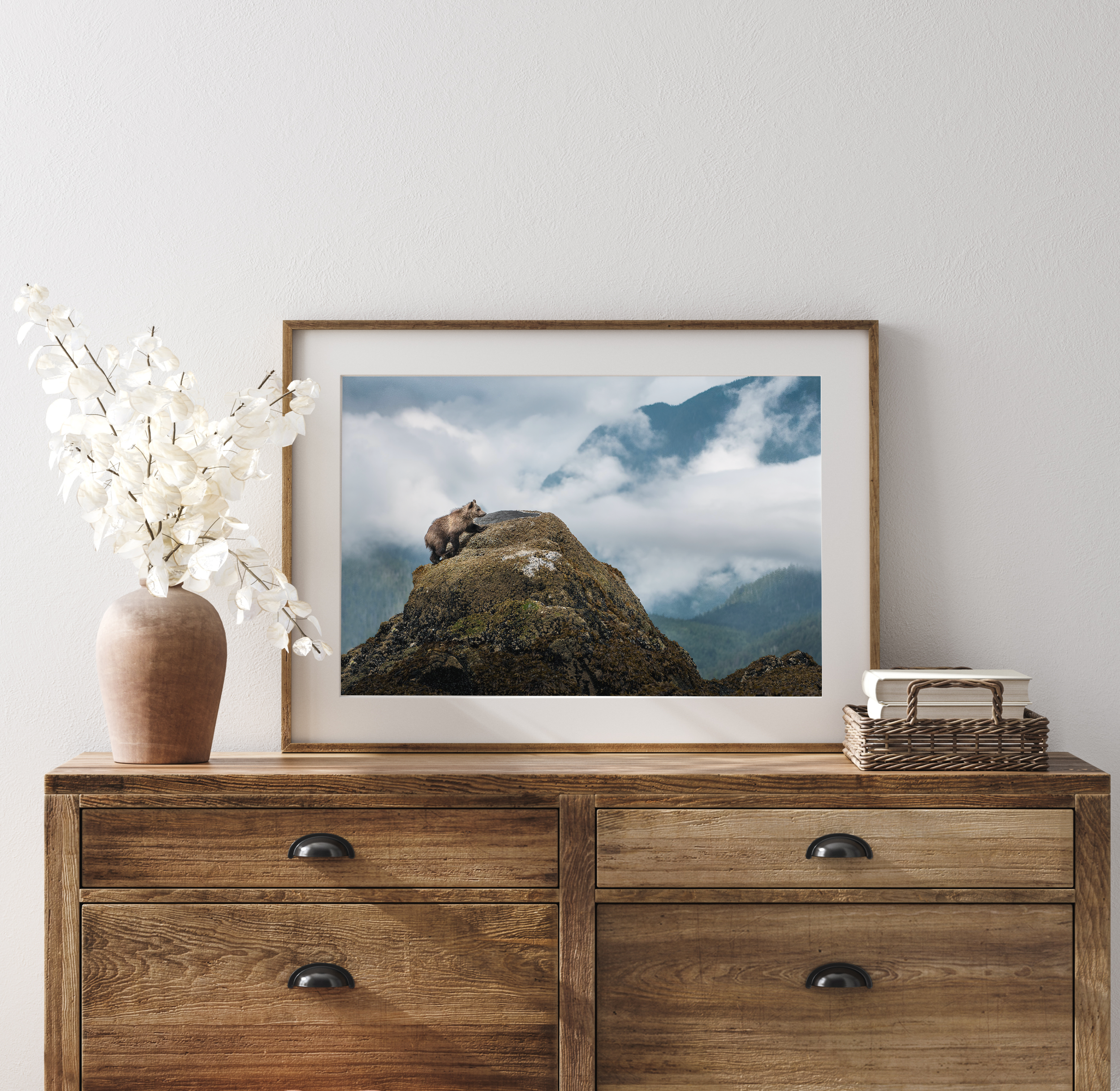 Grizzly bear cub print on wood drawer - A medium-sized print of a grizzly bear cub, tastefully placed on a wooden drawer.