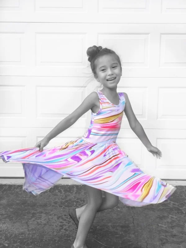 TWIRL ALL THE WAY TO NEVERLAND, LITTLE ONE! This adorable Twirly dress by Dotdotsmile Lori Weitzel VIP in splashes of fun watercolors makes for the perfect summer dress.