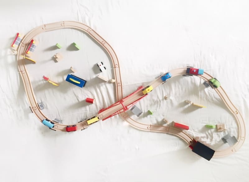 Current hands-on play obsession at home is this Cubbie Lee toy Company Wooden Train Set .