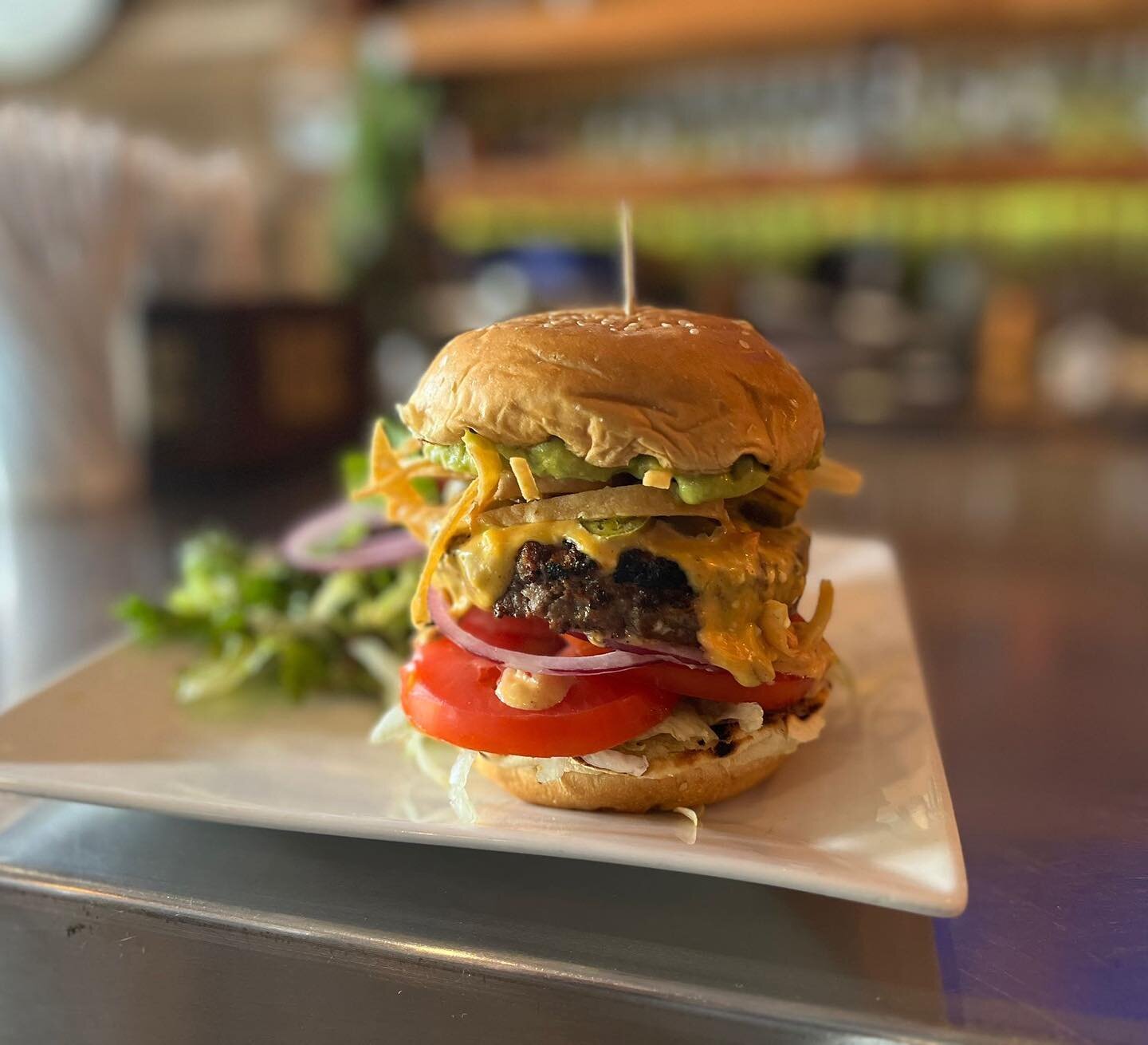 BIG FRIDAY &ldquo;NACHO CHEESE&rdquo; BURGER

An 8oz grilled patty topped with our home-made nacho cheese sauce, pickled jalape&ntilde;os, shredded lettuce, crispy tortilla strips, avocado salsa, tomato &amp; red onion on a toasted sesame bun