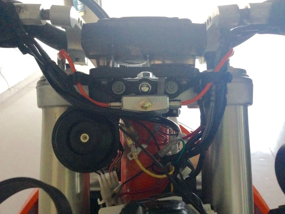 ALTERNATE MOUNTING POSITION, MUST REMOVE HEADLIGHT SURROUND TO MAKE PRESSURE ADJUSTMENTS.