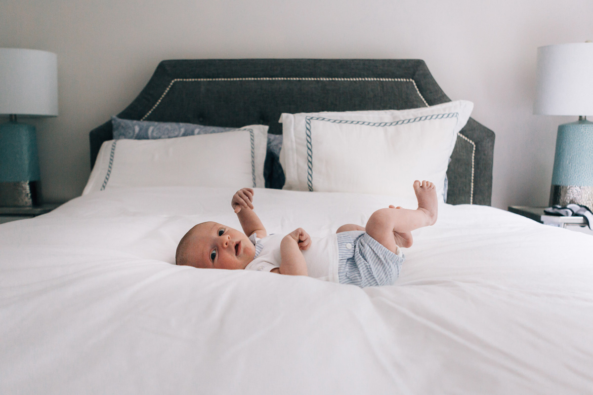 newborn baby on the bed - laura barr photography