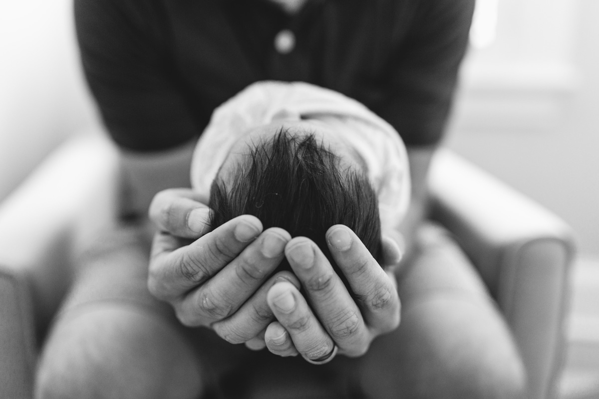 baby in hands by laura barr photography