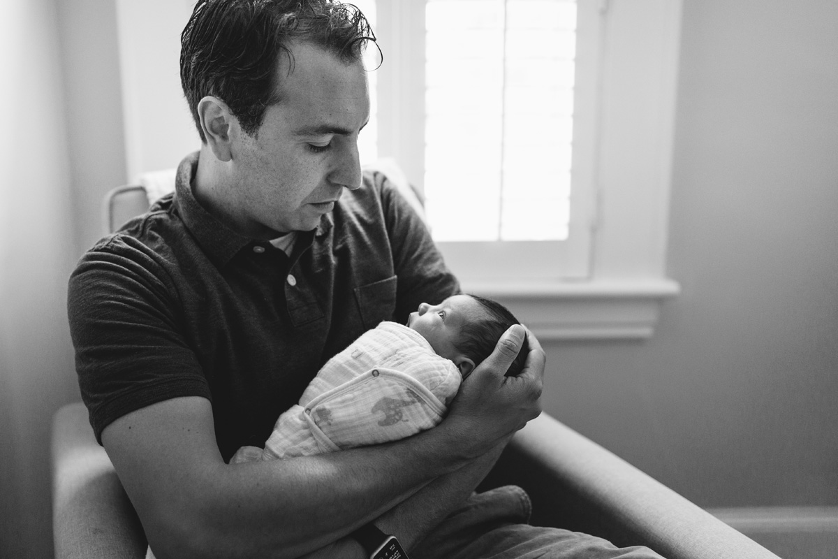 dad holding daughter