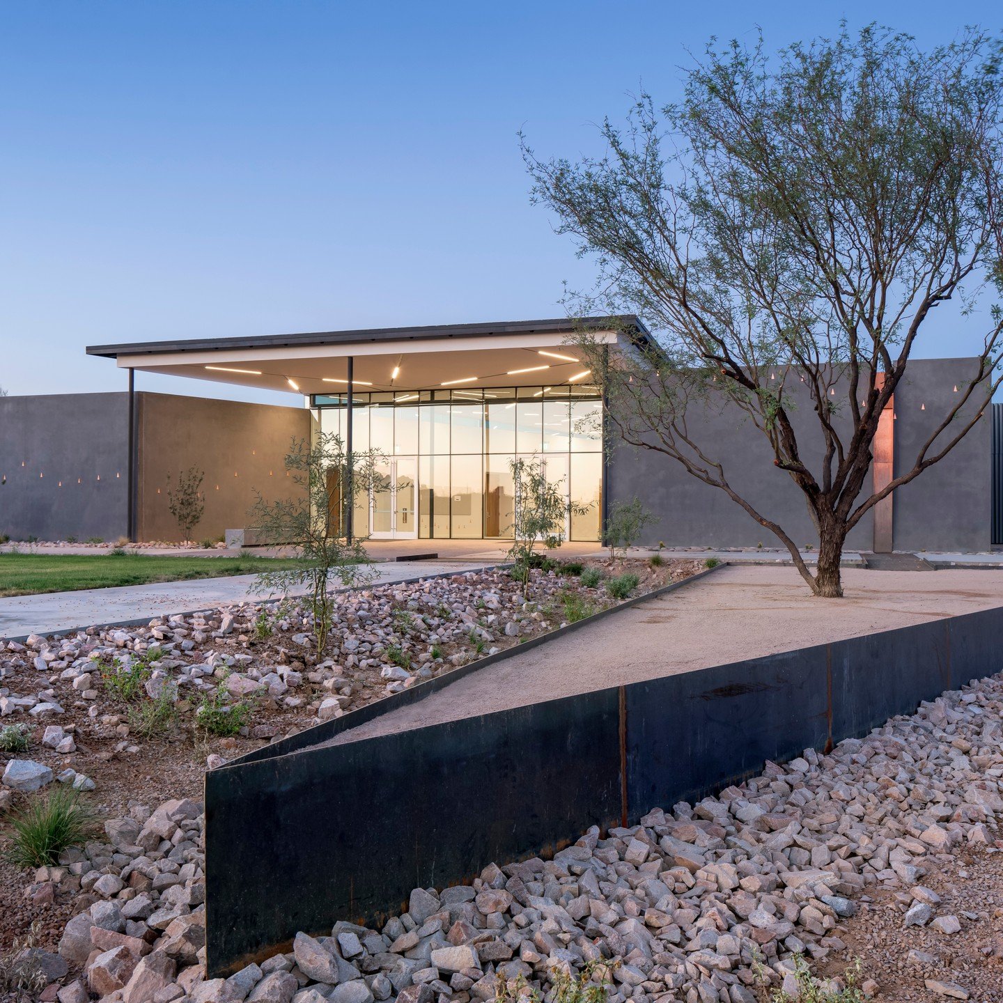 Happy Earth Week! As a design studio, we try to celebrate the Earth with every project we create. These details are sometimes literally embedded into the project itself.
Native plants and building design reflect the Sonoran Desert and the project's
