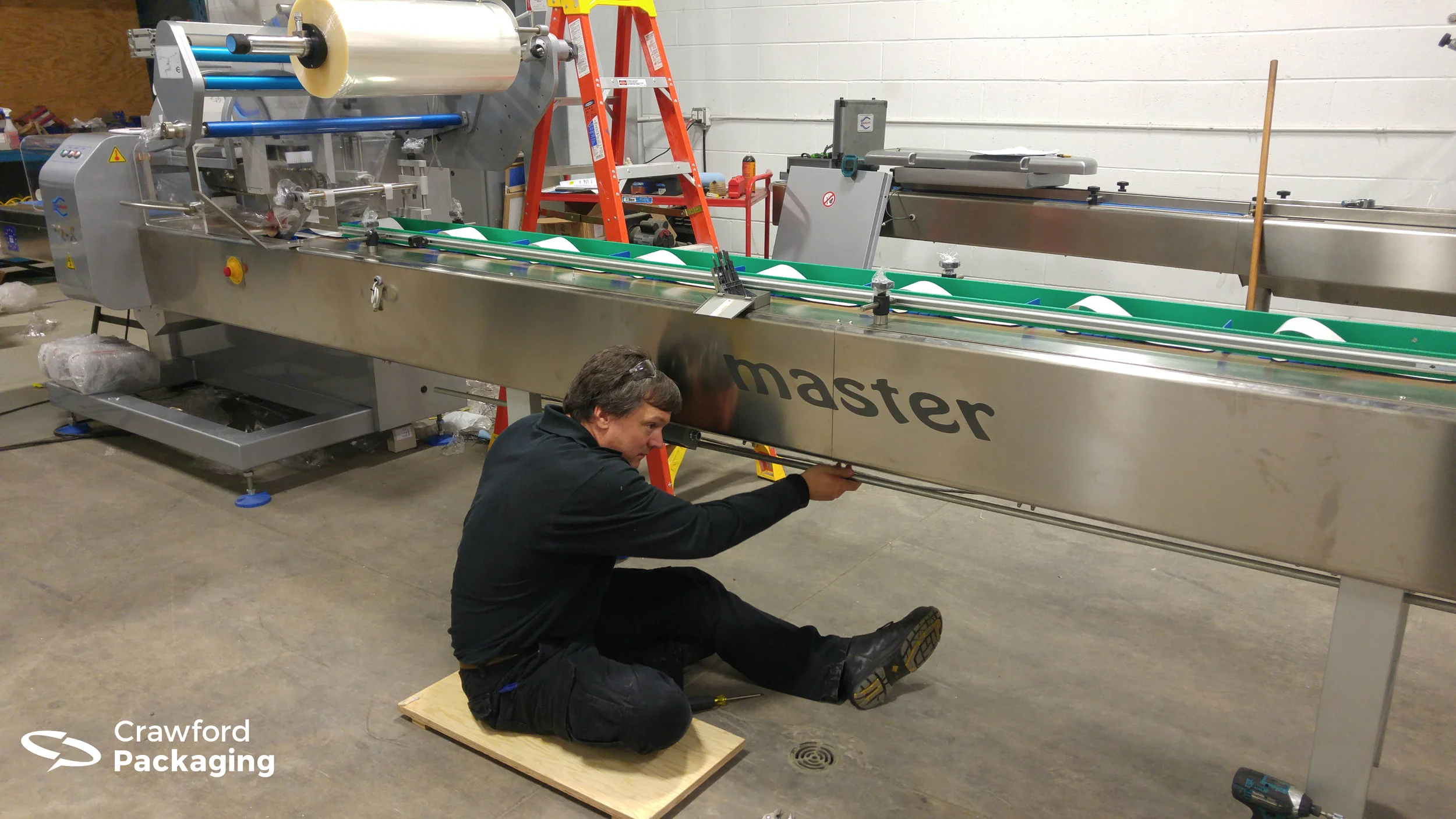 Our newest Service Technician Dave working on a RGD MAPE Master Flow Wrapper.