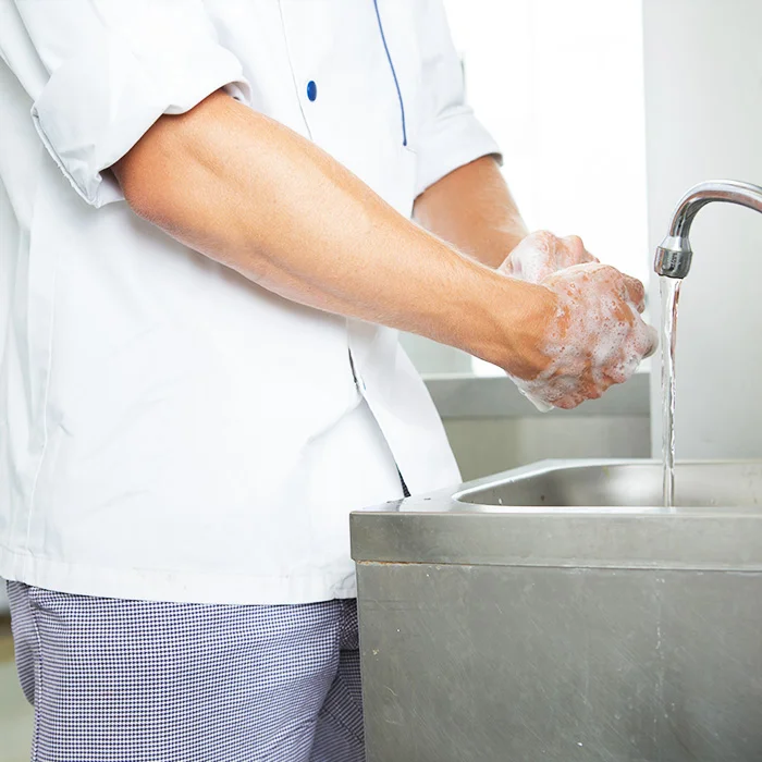 Chef washing hands before preparing meals