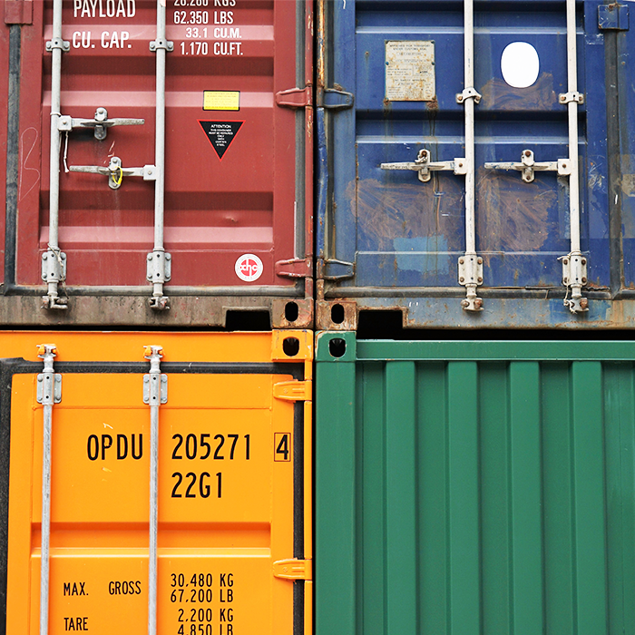 Coloured train shipping containers stacked on top of each other