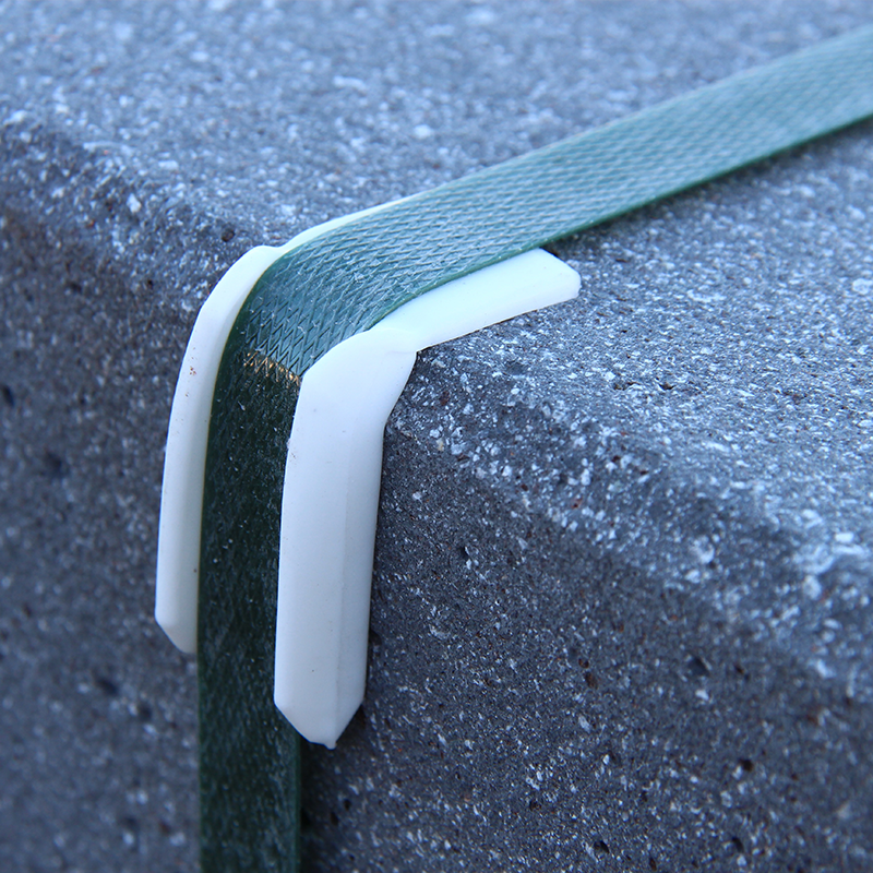 black polyester strapping securing heavy load of construction material