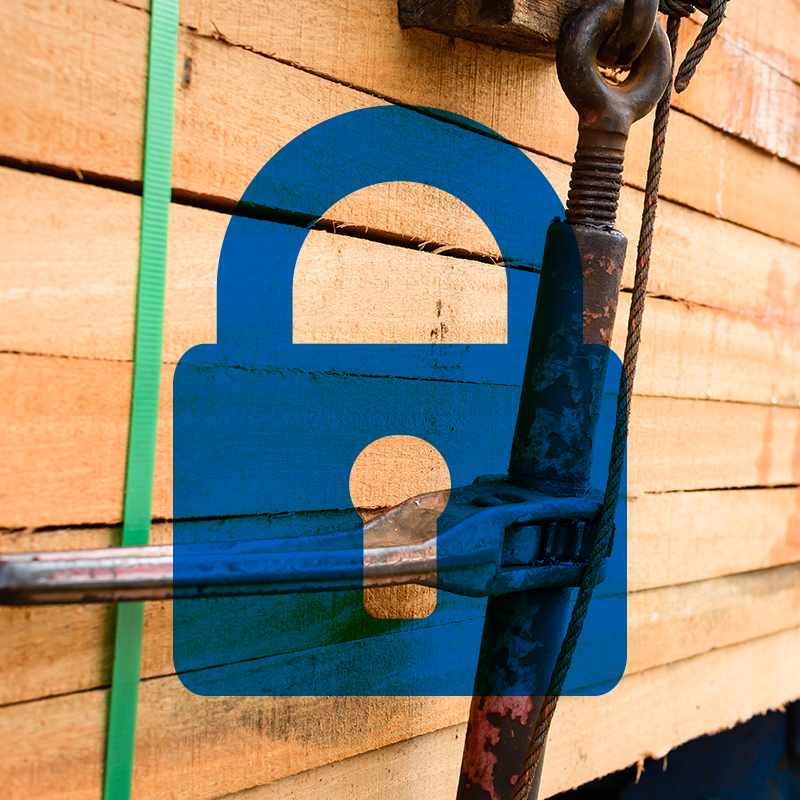 blue icon of padlock on top of close of up photo of lumber materials on transport truck
