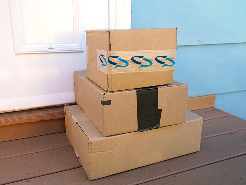 stack of three boxes on door step with custom printed branded water activated tape