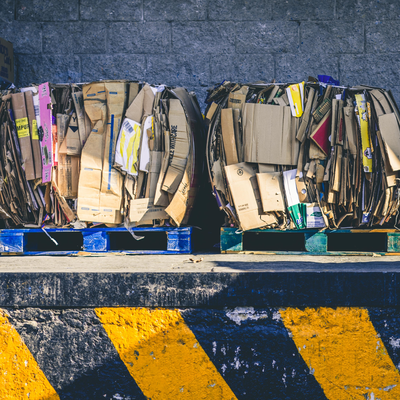bundles of recycled cardboard on loading dock