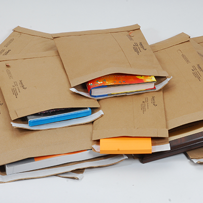 jiffy padded mailers stacked on white background