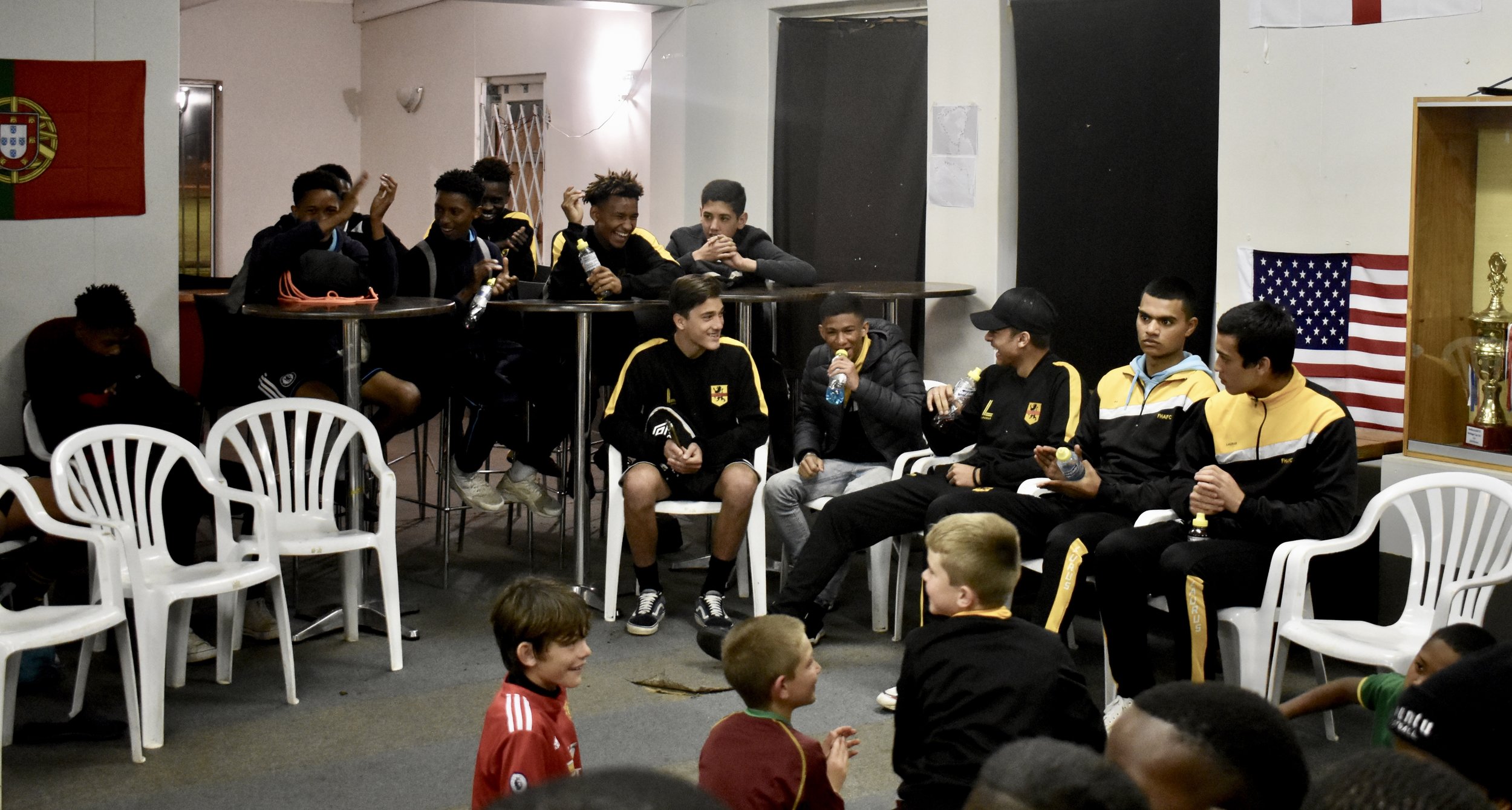 Aidan, Keenan, Nur, Alex, and Tristan celebrate with other members of Ubuntu Football Academy. (Robin and Luto had already arrived in the U.S.)
