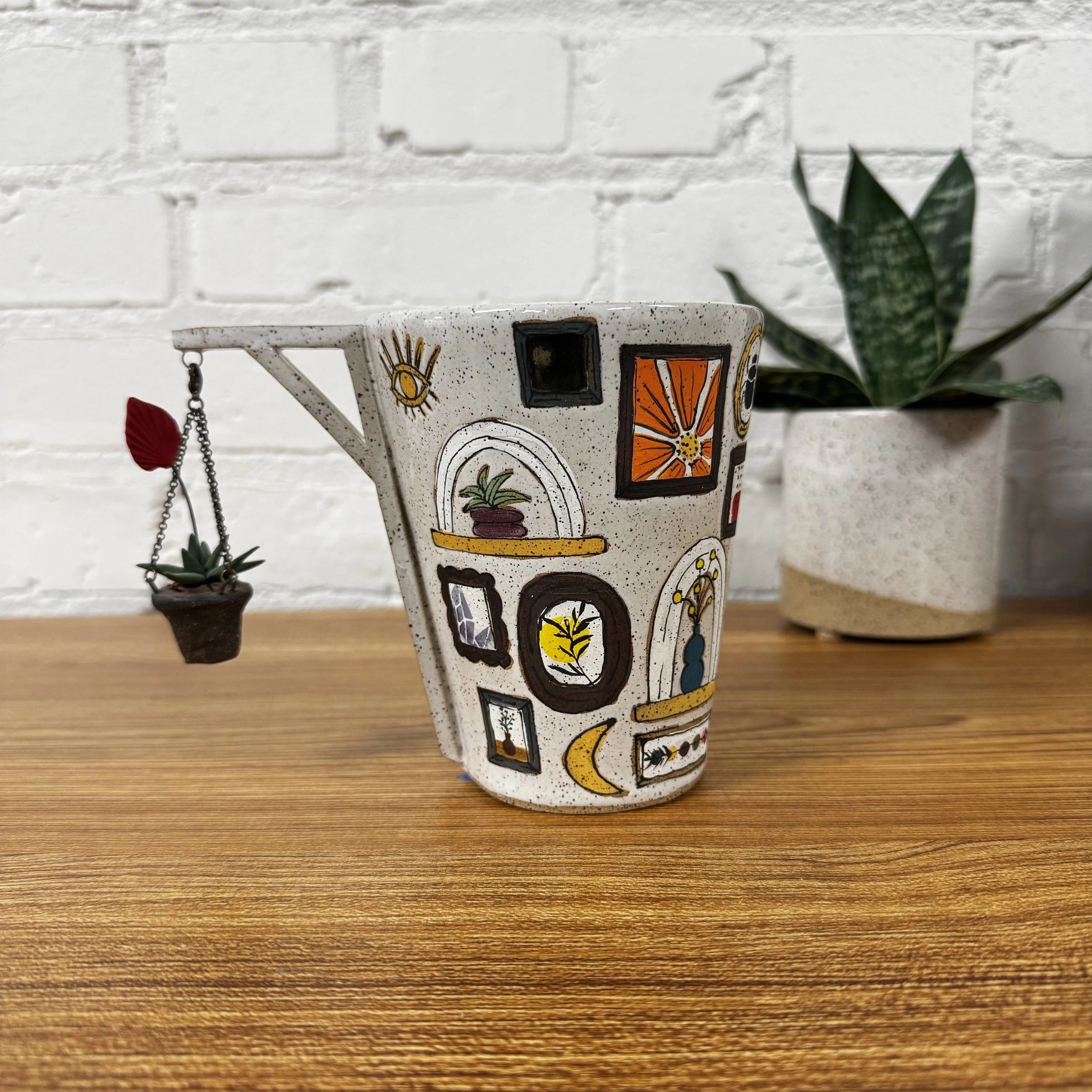 34- Gallery Wall Tumbler with Bromeliad + Pink and Green Tapestry