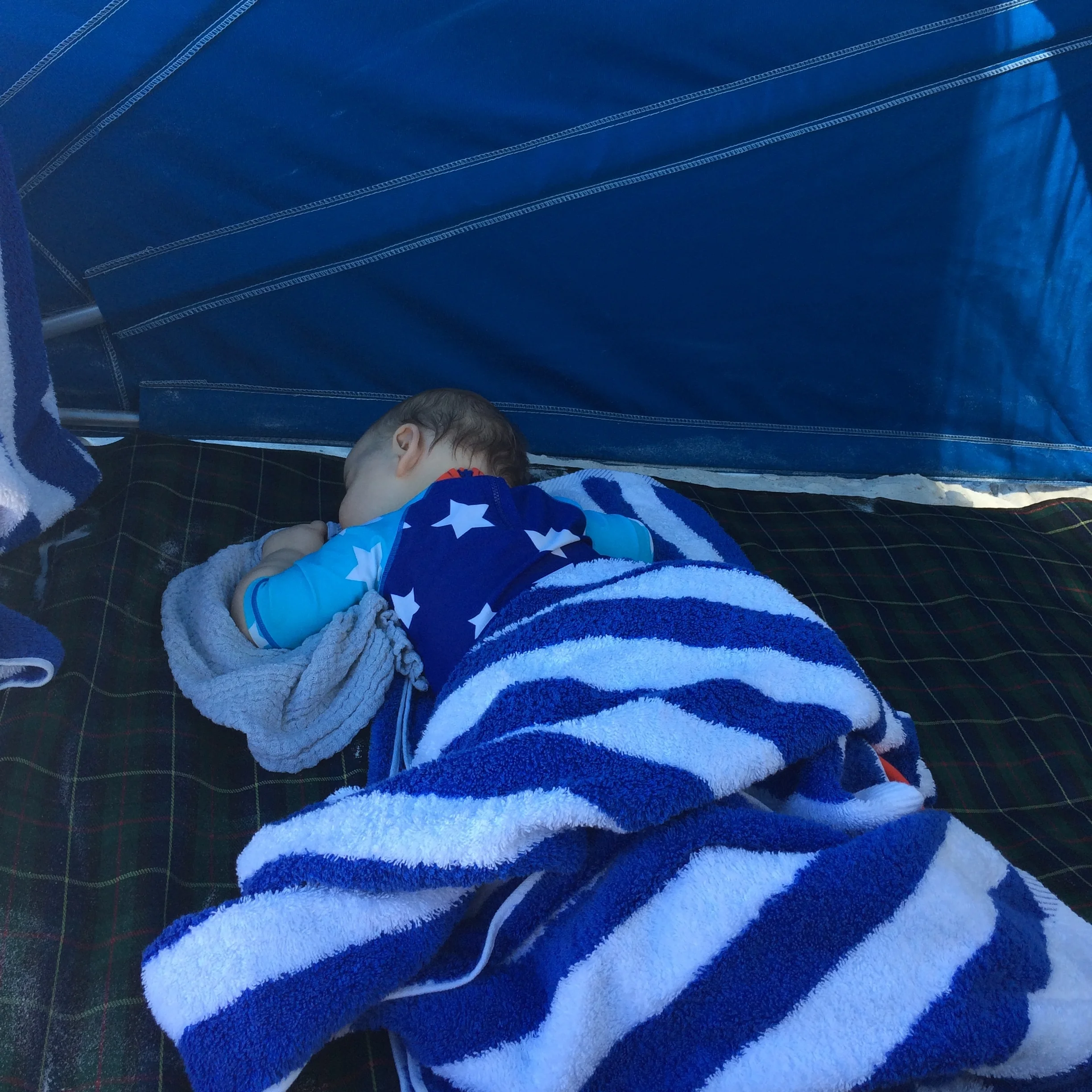 Here is Frank, aged 10 months, asleep on a beach in the holiday sunshine. How idyllic hey? This nap took 20 minutes of screaming/shushing/squirming to achieve. This nap lasted 20 minutes. In the 20 minutes, I took this photo of our great achievement (getting him to sleep) and then read my book.