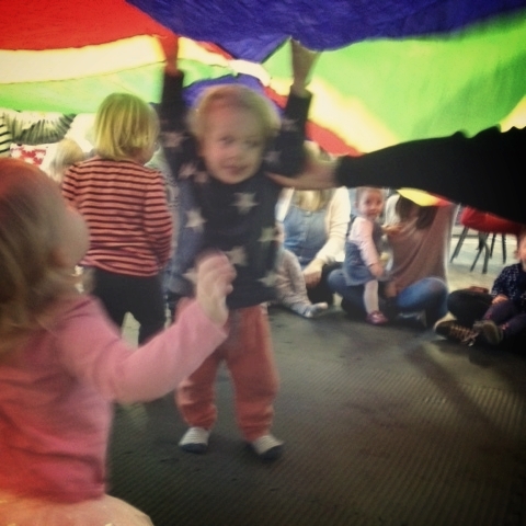Oscar getting over excited about the parachute at music class and literally being dragged out by the teacher
