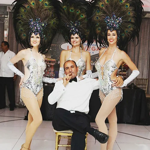 Vegas dance performers posing with client