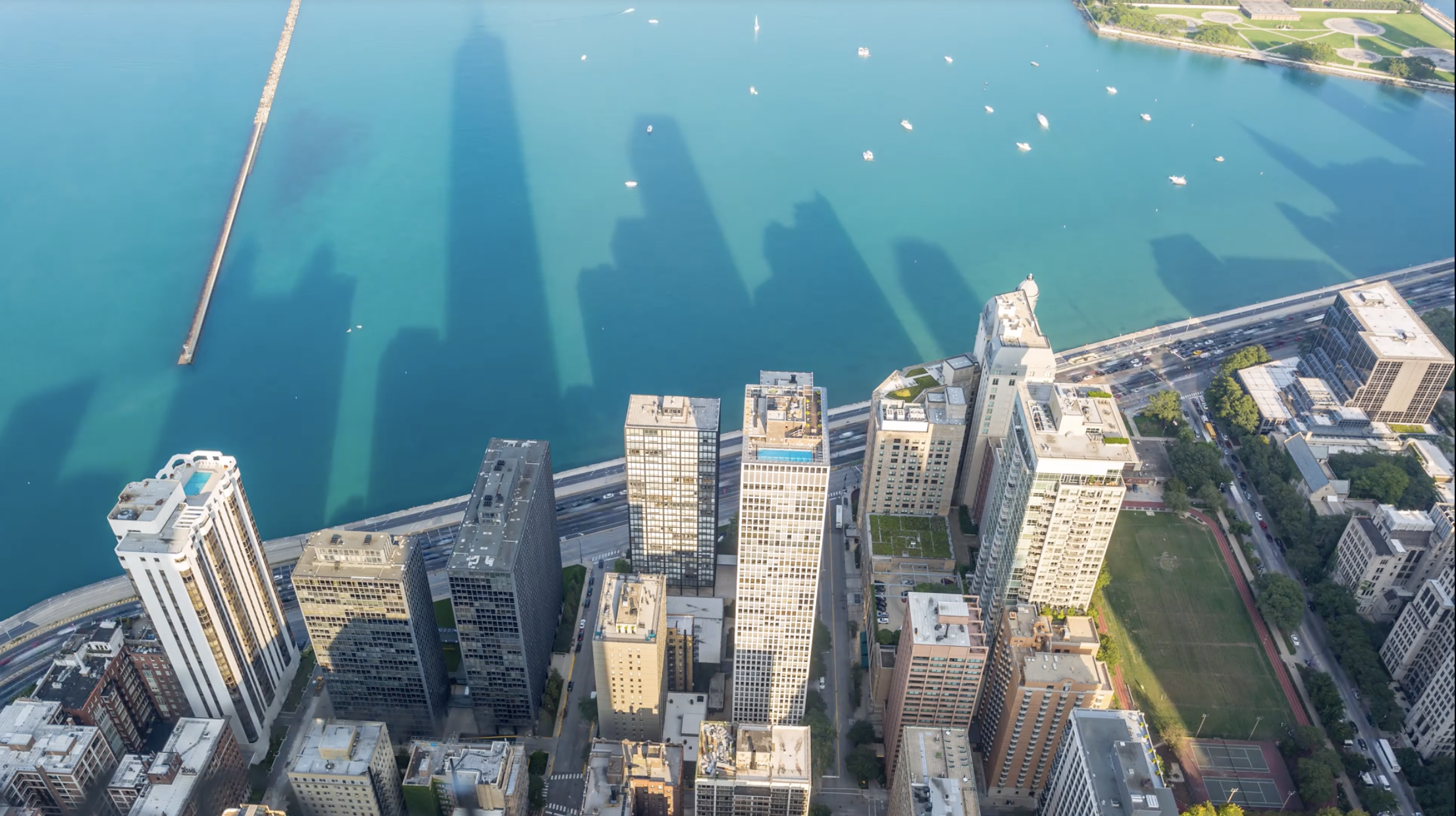 Chicago Skyscrapers Shadows on Lake Michigan Aerial Day.png