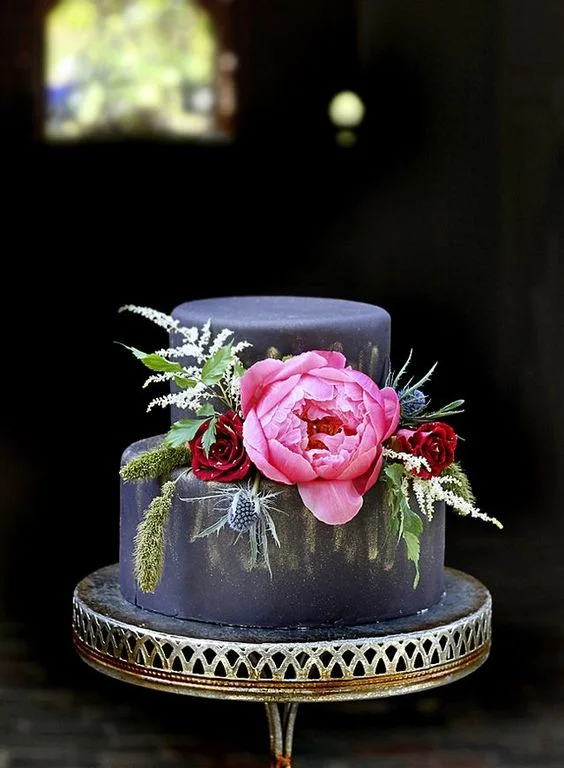 I really love the contrast of the black fondant covered cake. Especially with vibrant florals!