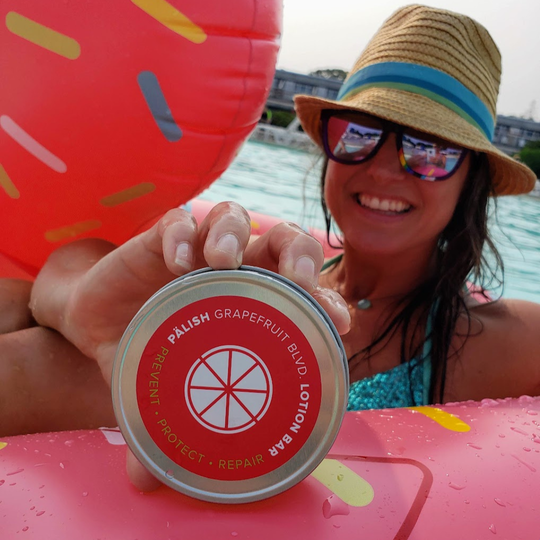 lotion bar held by a girl in provincetown grapefruit scent made by palish natural skincare in columbus ohio .png
