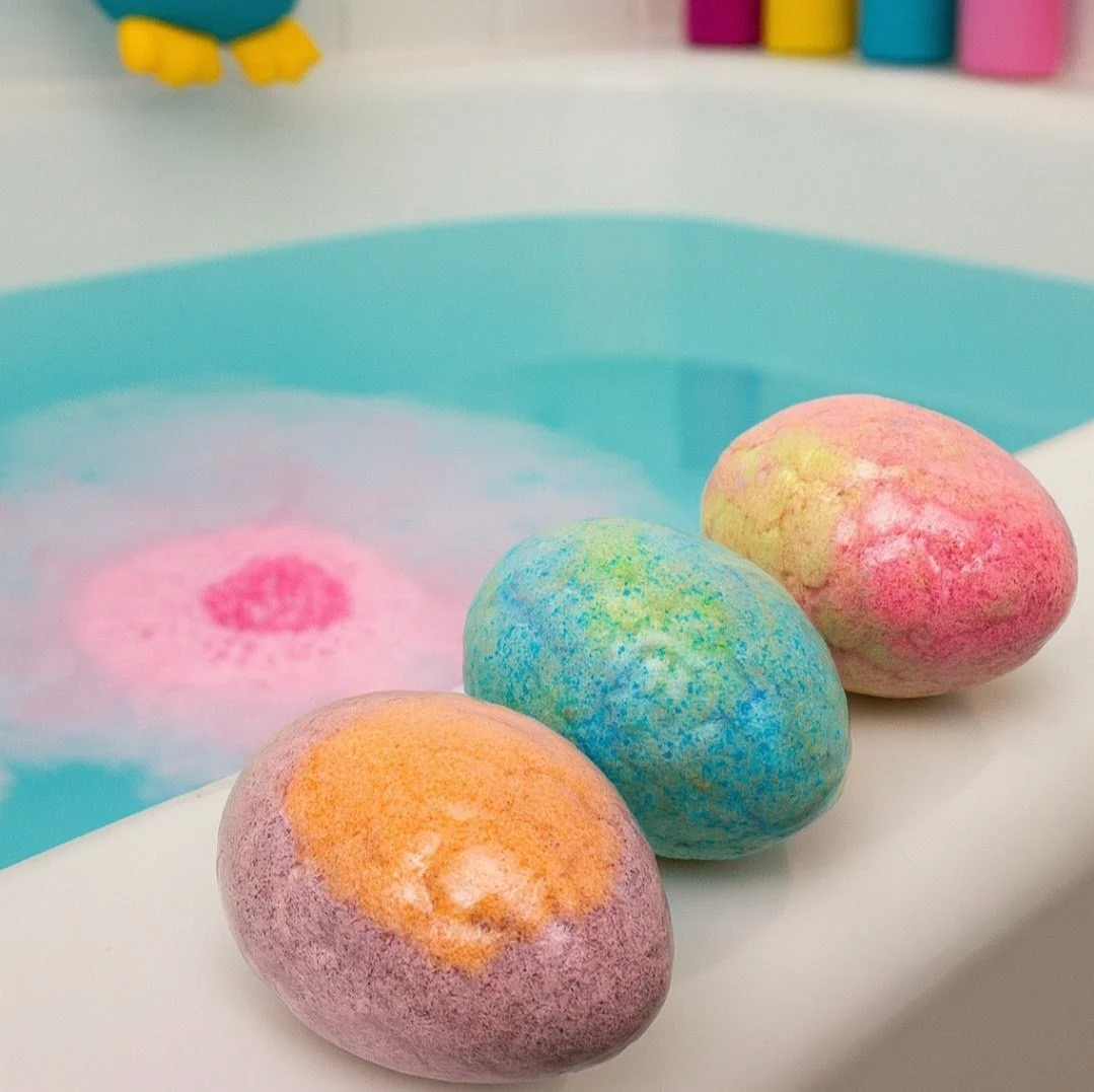 Bath bombs next to a bath tub ready to be used and enjoyed to keep the little ones clean in columbus ohio and made by palish natural skincare with clean ingredients.jpg