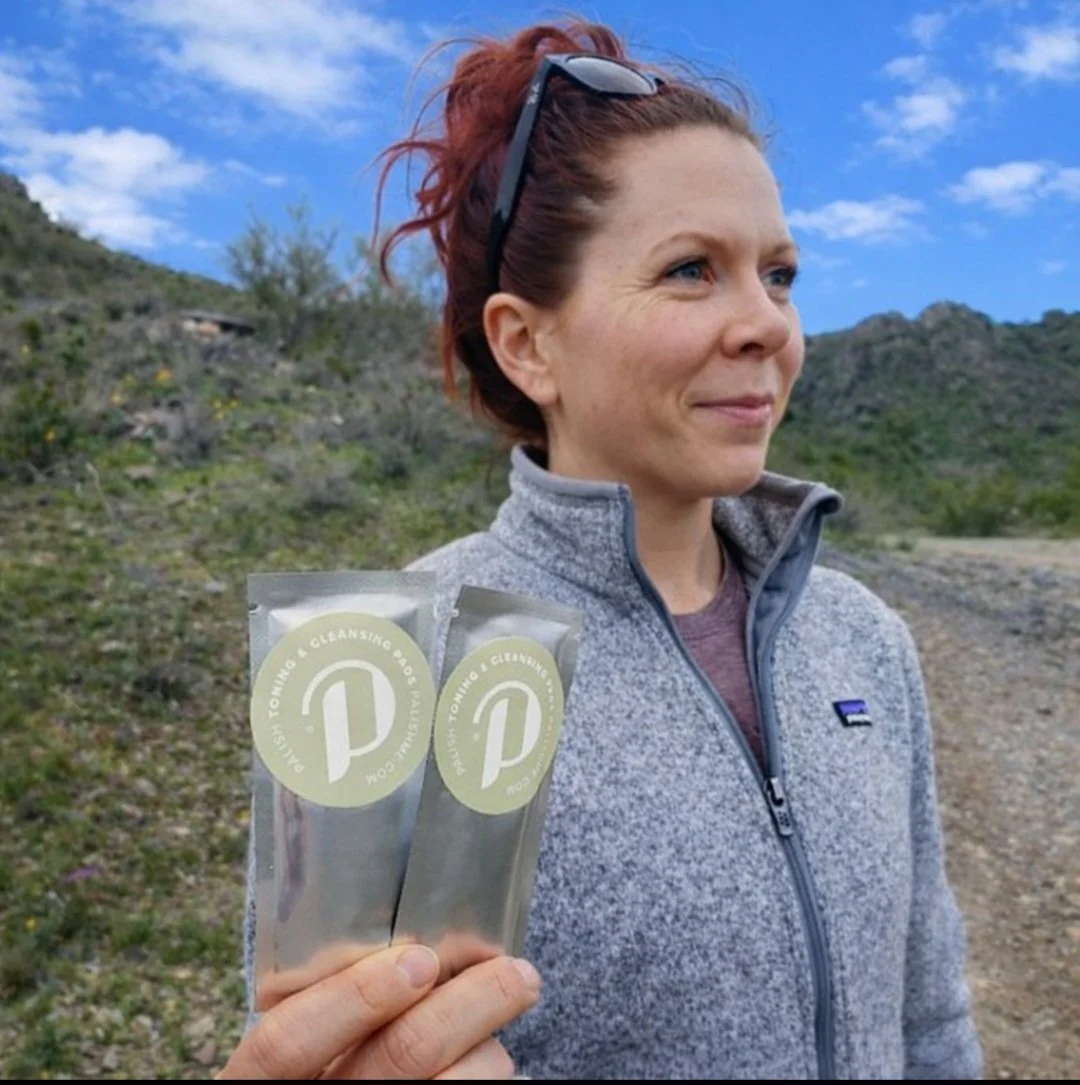 Hiker holding the individual toning and cleansing pads perfect for all your adventures made in ohio .jpg