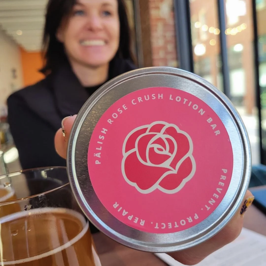 Girl sitting at a bar in Boise Idaho with the rose crush lotion bar by palish natural skincare that is made for super hydration with clean ingredients.jpg