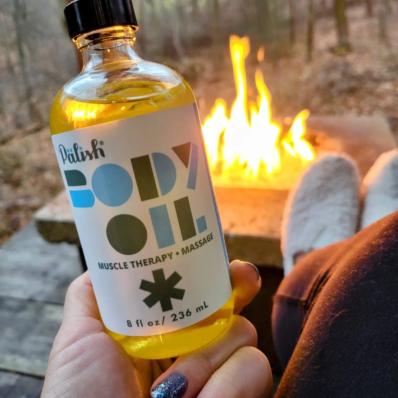 Massage body oil by a fire at an airbnb in millersburg ohio is a great way to stay hydrated and relax made by palish in ohio.jpg (Copy)