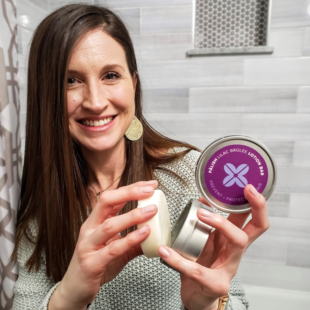 Girl holding lilac lotion bar by palish natural skincare in columbus ohio made with natural ingredients for hydration you can take anywhere.png