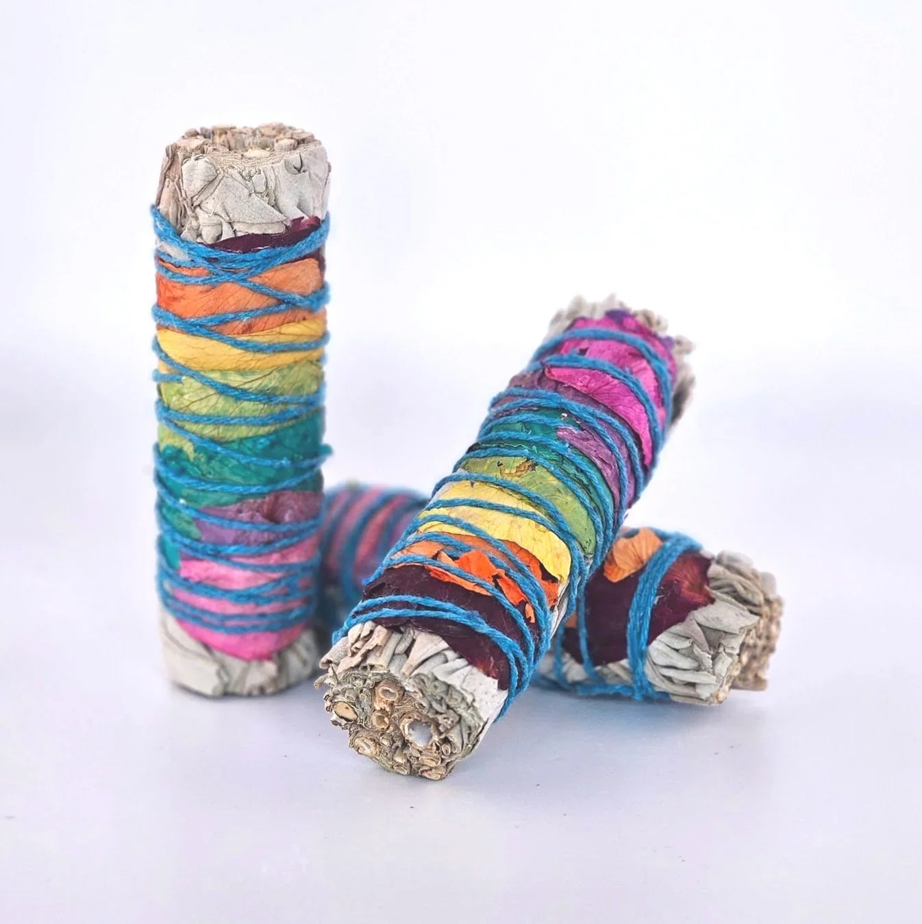 sage+smudge+stick+wrapped+in+beautiful+flower+petals+for+cleaning+house+and+calming+senses.jpg