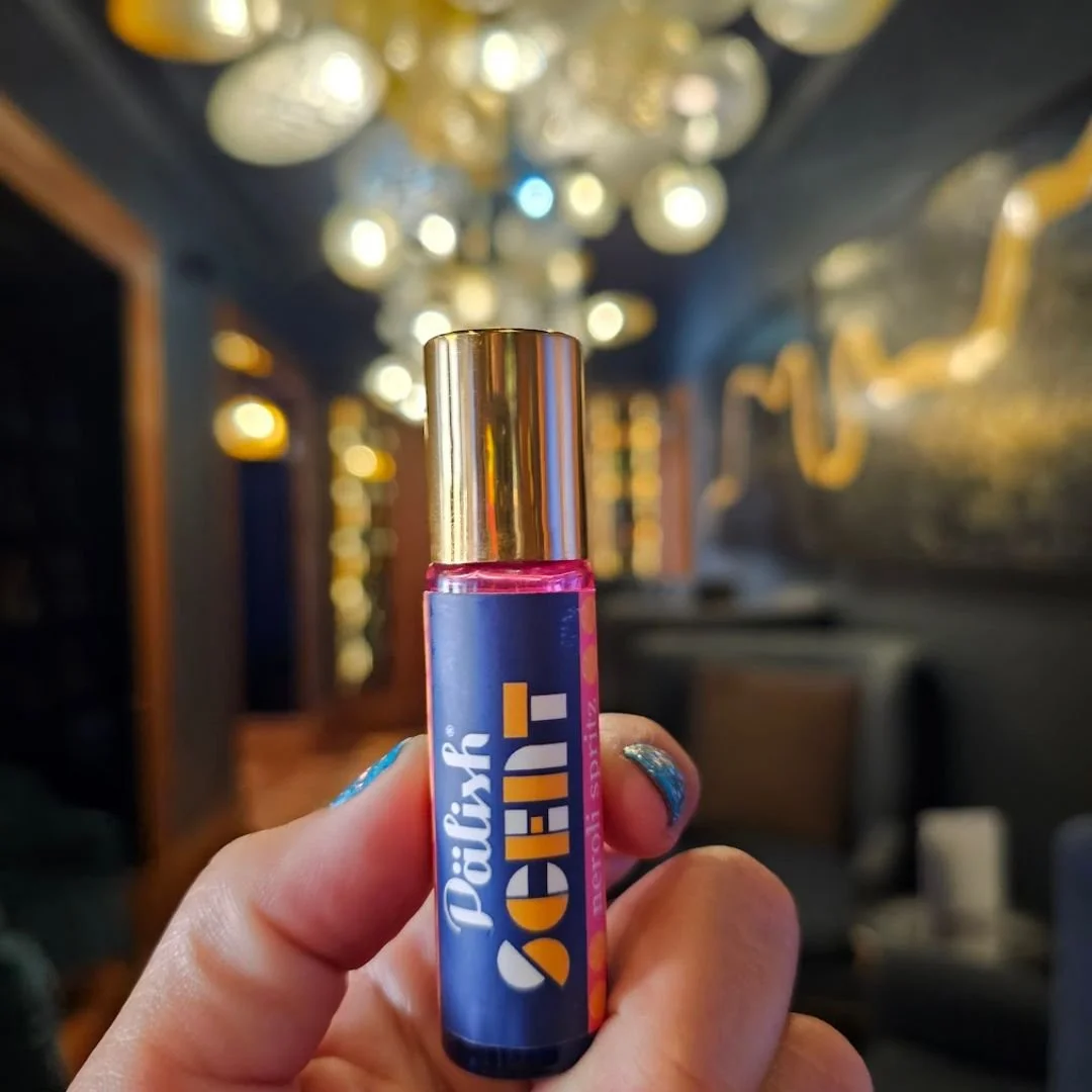 Neroli perfume held by a woman in london england is a soft blend of blood orange and neroli oil for a sweet and unexpected experience in fragrance made by palish .jpg