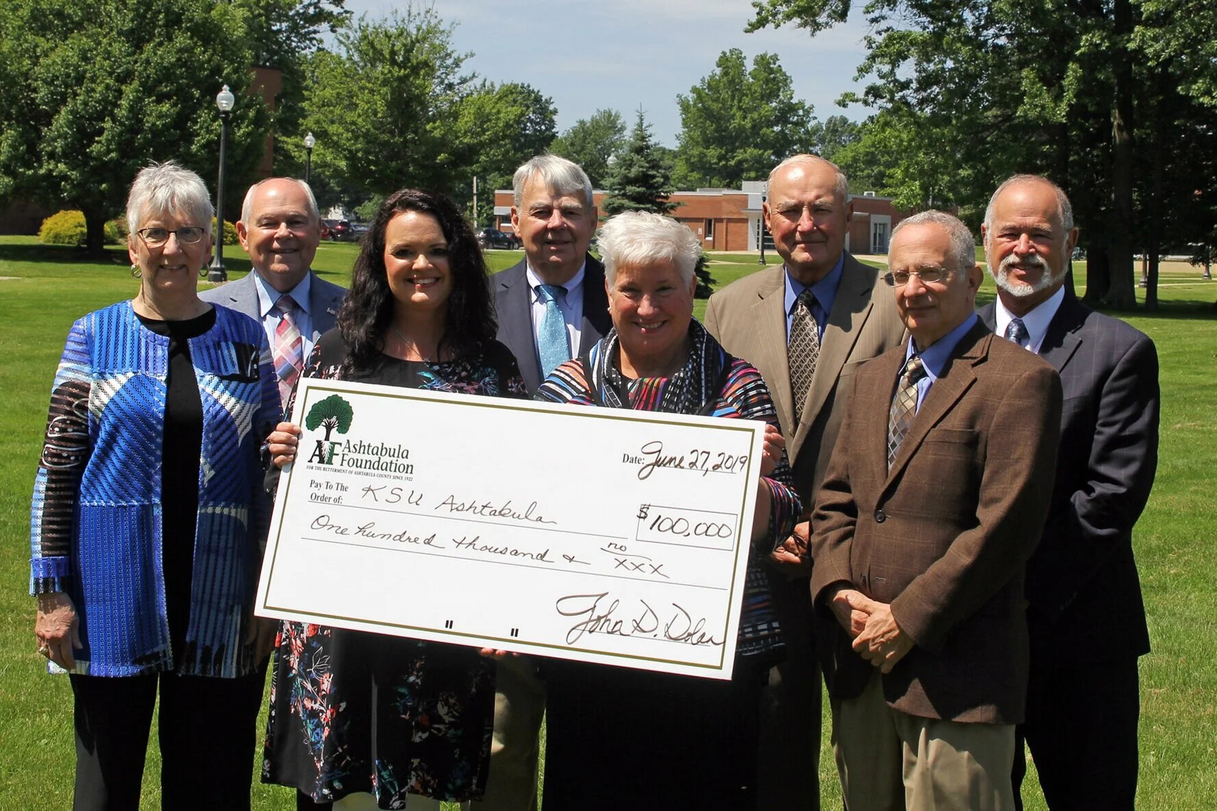 PHOTO: Members of the Ashtabula Foundation present a ceremonial check in the amount of $100,000 to start an endowed fund in support of the Rising Scholars program at Kent State University at Ashtabula. Pictured are (left to right) Trustee and Past President Cheryle J. Chiaramonte, Trustee Roger A. Corlett, Associate Lecturer of Theater and Kent State Ashtabula Rising Scholars coordinator Natalie Huya, Board Secretary/Treasurer William W. “Bud” Hill, Kent State Ashtabula Dean and Chief Administrative Officer Dr. Susan J. Stocker, Board President John D. Dolan, Trustee G. Richard Coblitz, and Trustee Dr. Jerome A. Brockway. ###