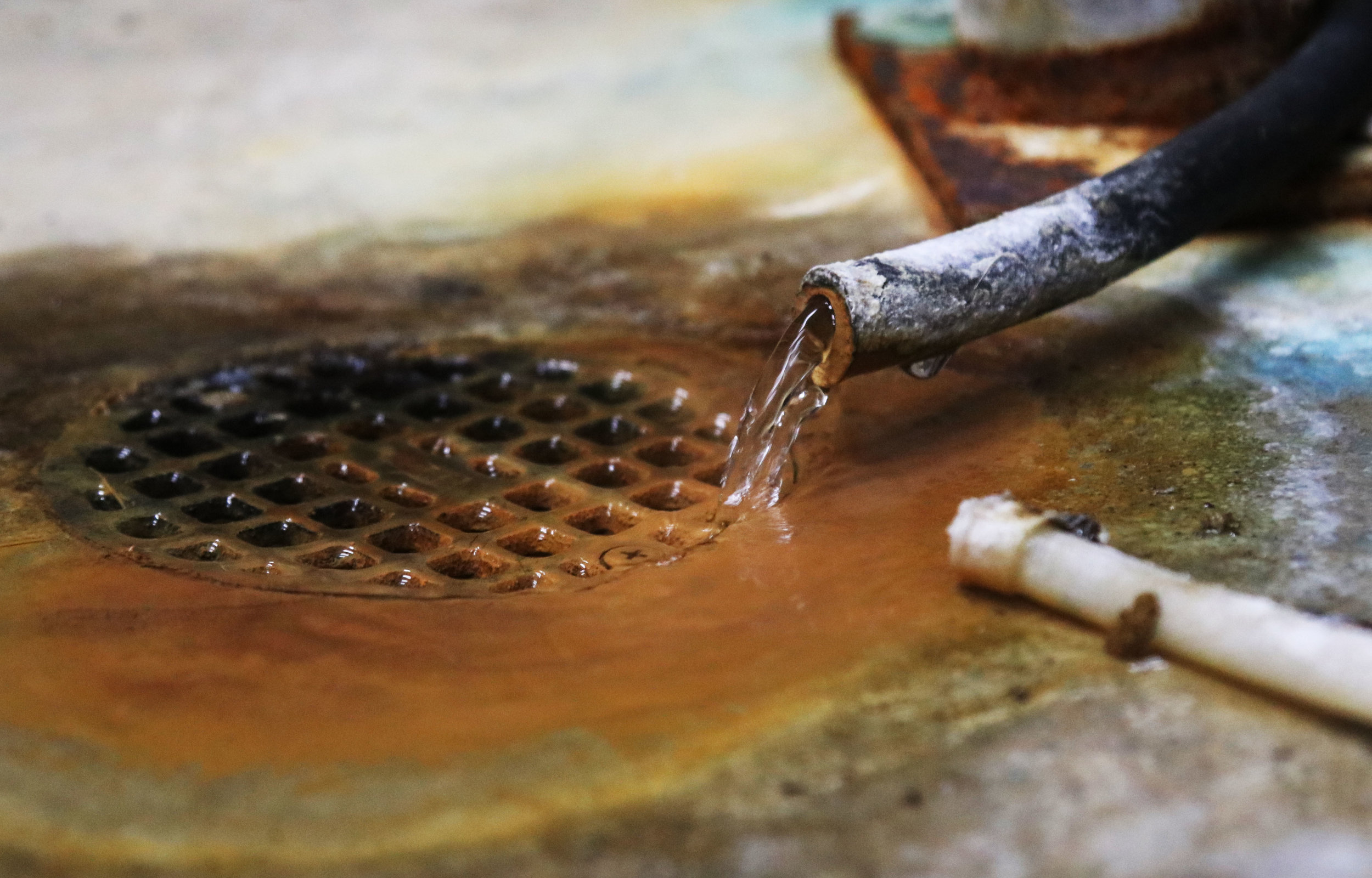  Water runs out of a pipe in the water pump house in Martinsburg, Missouri on Saturday, April 8, 2017. Bill Fennewald, vice president of M. Fennewald Pump Service, said this is the sample water they test every day. Photo by Emil Lippe. 