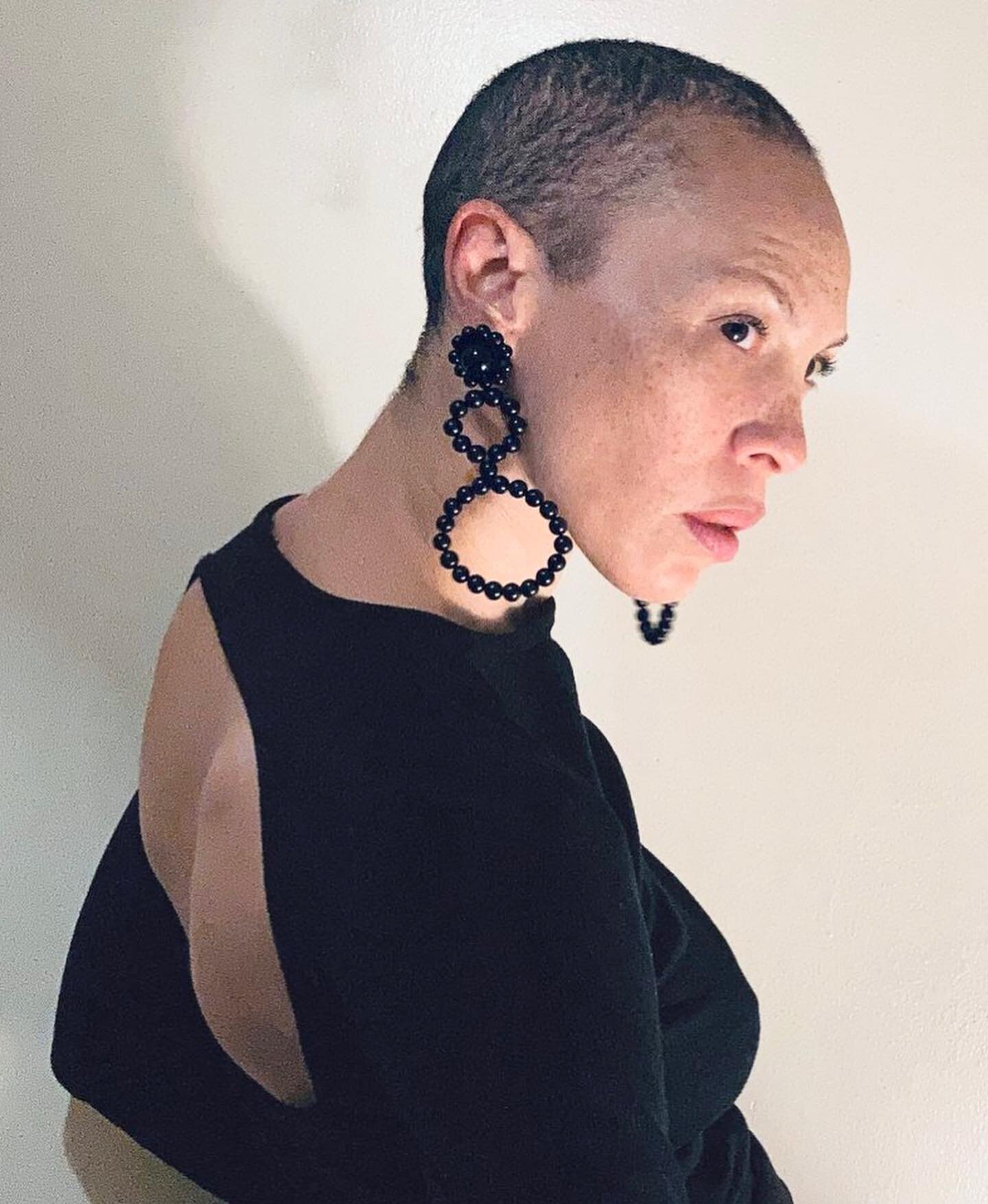 Statement wood earrings inspired by the femme fatales of 1960s Italian cinema. Handcrafted with ebony beads arranged in three graduated circles topped with a glossy vintage acrylic dome. Available in dark brown as well. Only two pairs currently avail