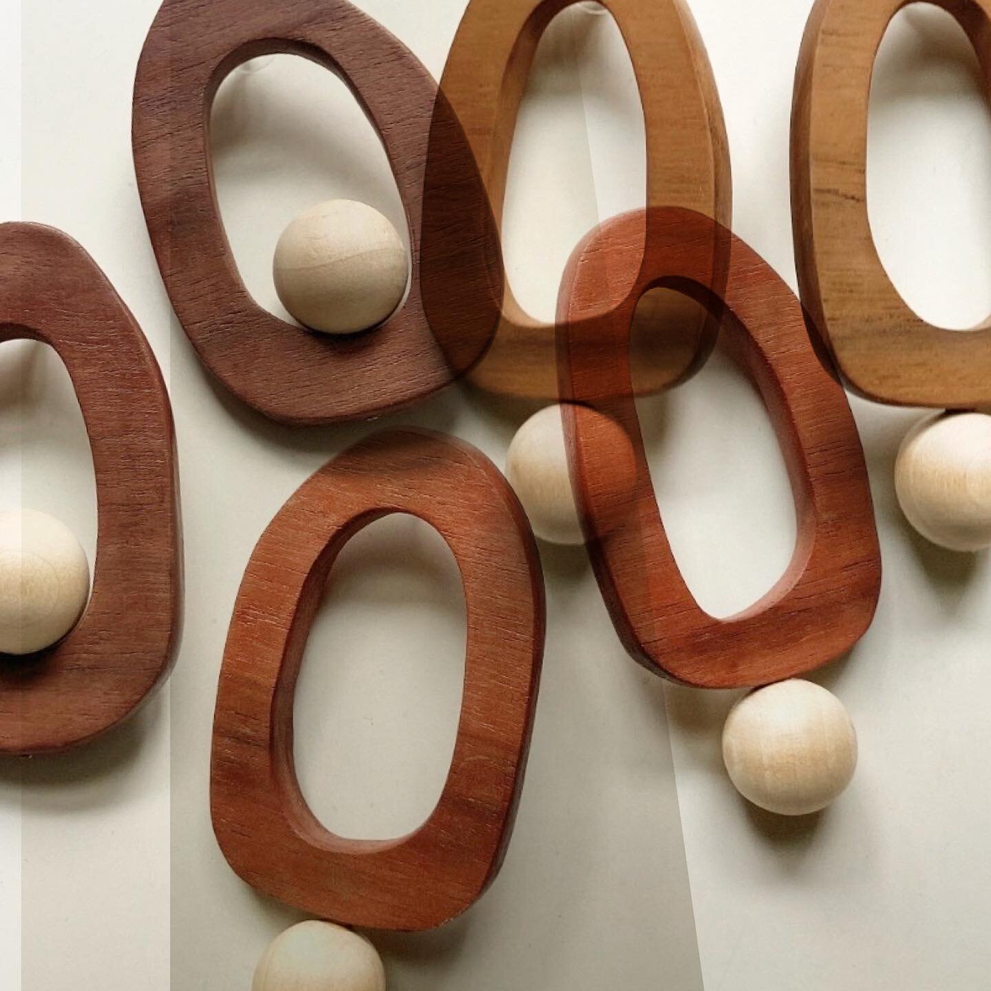 Somma Ball + Somma Sphere &bull; Sculptural, organic shape wood hoops. Each pair are individually hand cut and formed from reclaimed cherry and walnut. Not only are no two pair identical, the pairs themselves are not perfectly symmetrical lending fur