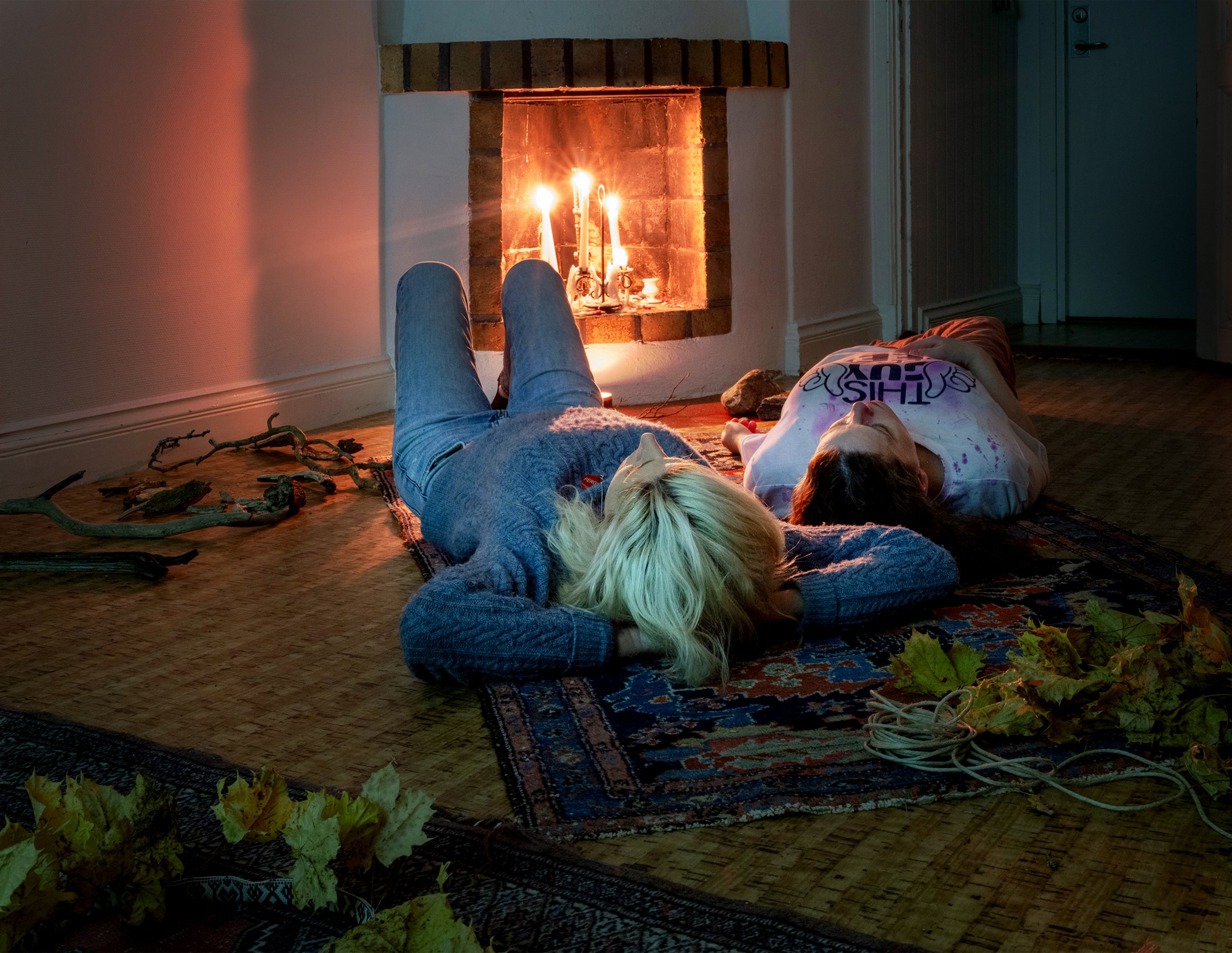 Healing Ritual:  Create Your Own Ritual  2025, Björkö Konstnod, Björkö, Sweden, installation view  Leaves sewn into wreaths, ribbon, paper, twine, found furniture, candles, signage with instructions in English and Swedish, sound, projected video 