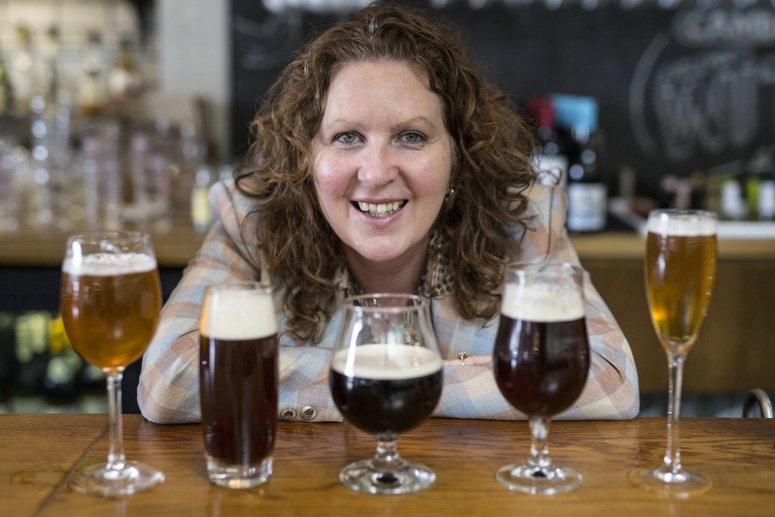 Jane Peyton with array of beers high res.jpg