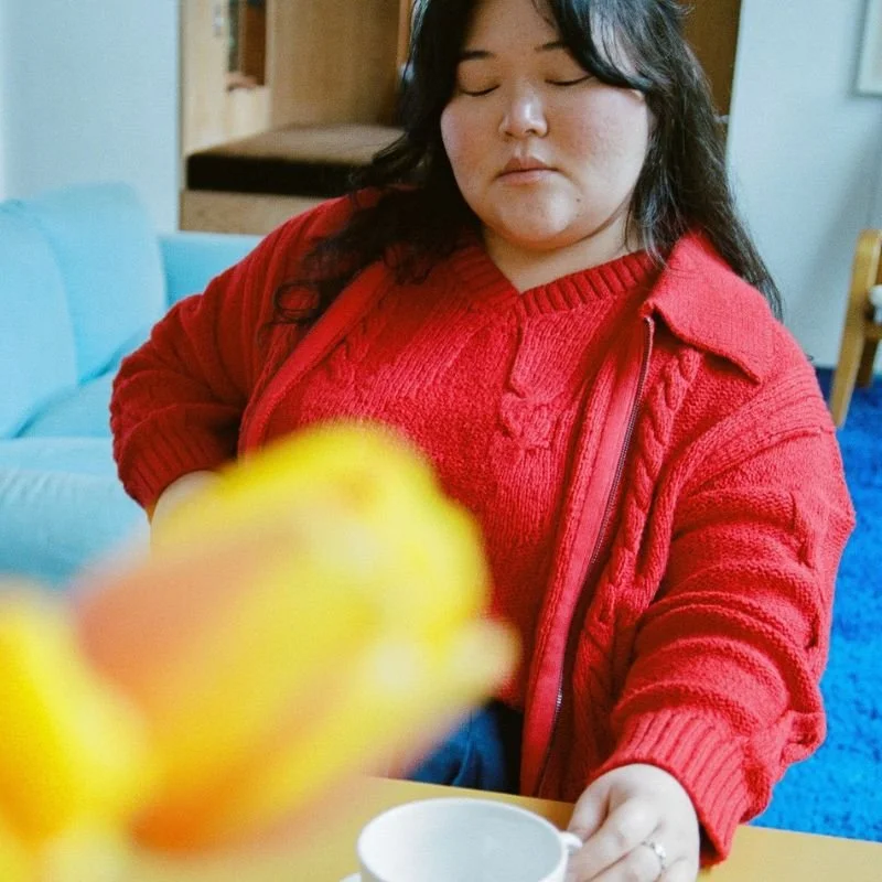 Woman wearing April Knit Studio red sweater