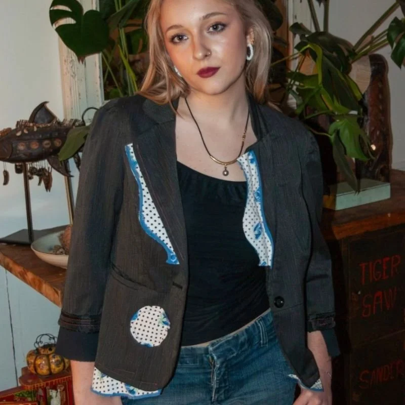 Model wearing Crooked Stitch upcycled blazer