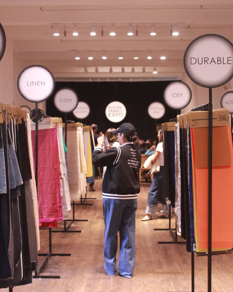 Woman at sustainable fashion textiles trade show